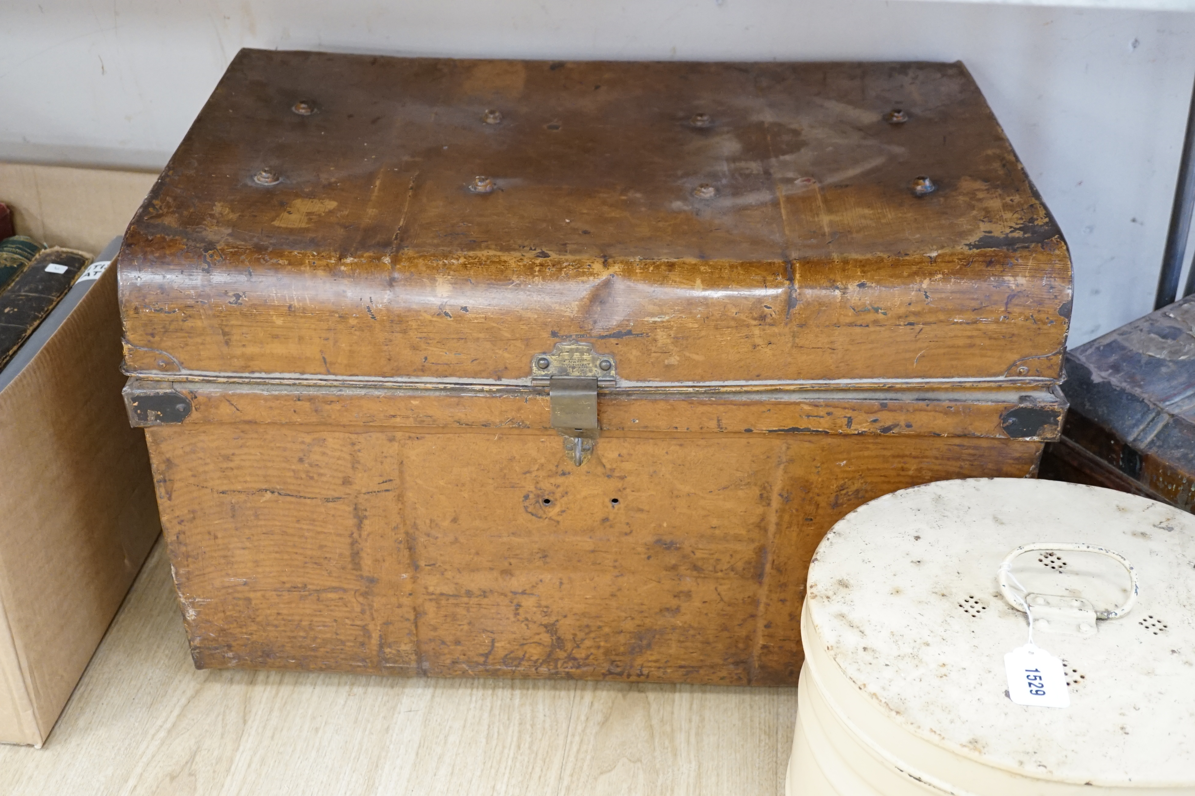 A large painted tin trunk, a smaller trunk and a cream hat tin, largest 70cm wide
